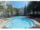 Resort-style community pool and hot tub offer a luxurious escape, complemented by ample seating and manicured grounds at 1850 Cotillion Dr # 3123, Dunwoody, GA 30338