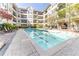 Exterior view of a refreshing, large community swimming pool surrounded by lounge chairs and lush landscaping at 1850 Cotillion Dr # 3123, Dunwoody, GA 30338