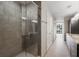 Modern bathroom featuring a glass shower, granite countertops, dark wood cabinetry, and tile floors at 3325 Piedmont Ne Rd # 1801, Atlanta, GA 30305