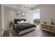 Cozy bedroom featuring natural light, a comfortable bed, and stylish decor at 3325 Piedmont Ne Rd # 1801, Atlanta, GA 30305