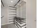 Organized walk-in closet featuring white shelving and drawer systems for efficient storage and organization at 3325 Piedmont Ne Rd # 1801, Atlanta, GA 30305