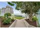 Rooftop green space featuring beautiful landscaping, artificial turf, and lush greenery with trees and plants at 3325 Piedmont Ne Rd # 1801, Atlanta, GA 30305