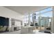 Bright kitchen features an island, modern appliances, and an adjacent lounge area with city views at 3325 Piedmont Ne Rd # 1801, Atlanta, GA 30305