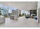 Modern living room featuring floor-to-ceiling windows, a marble fireplace, and comfortable blue seating at 3325 Piedmont Ne Rd # 1801, Atlanta, GA 30305