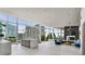 The living room has large windows with city views, a fireplace, and a comfortable seating area at 3325 Piedmont Ne Rd # 1801, Atlanta, GA 30305