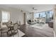 Bright living area with a dining space, hard wood floors, and amazing views of the surrounding skyscrapers at 3325 Piedmont Ne Rd # 1801, Atlanta, GA 30305