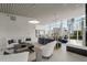 Modern lounge featuring comfortable seating, large windows with city views and sophisticated interior design at 3325 Piedmont Ne Rd # 1801, Atlanta, GA 30305