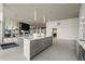 Open lounge with a modern kitchen island, city views, and access to an outdoor space at 3325 Piedmont Ne Rd # 1801, Atlanta, GA 30305
