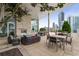 Relaxing rooftop terrace with comfortable seating, a stone fireplace, and a cityscape backdrop at 3325 Piedmont Ne Rd # 1801, Atlanta, GA 30305