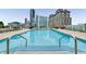 Rooftop pool offers a refreshing escape with city skyline views and lounge chairs for relaxation at 3325 Piedmont Ne Rd # 1801, Atlanta, GA 30305