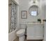Cozy bathroom with round mirror, shower and tub combination, and ample lighting at 882 Cedar Canyon Se Sq, Marietta, GA 30067