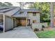 Exterior of a gray home with a covered carport and mature trees at 882 Cedar Canyon Se Sq, Marietta, GA 30067