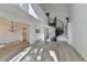 Spacious living room with a modern chandelier, hardwood floors, and a spiral staircase at 882 Cedar Canyon Se Sq, Marietta, GA 30067