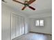 Bright bedroom with ceiling fan, large closet, and wood-look flooring at 882 Cedar Canyon Se Sq, Marietta, GA 30067