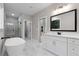 Elegant bathroom boasts a freestanding tub, walk-in shower, and white cabinets at 136 Rainey Rd, Temple, GA 30179