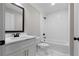 Modern bathroom with white subway tile, quartz vanity, and black fixtures at 136 Rainey Rd, Temple, GA 30179