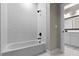 Bathroom with white subway tile and a shower/tub combo at 136 Rainey Rd, Temple, GA 30179