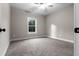 Bright bedroom with ceiling fan and neutral-toned carpet at 136 Rainey Rd, Temple, GA 30179