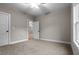 Spacious bedroom with neutral walls and carpet flooring at 136 Rainey Rd, Temple, GA 30179