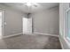 Spacious bedroom with carpet, neutral walls and access to a closet at 136 Rainey Rd, Temple, GA 30179