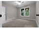 Bright bedroom featuring carpet and large windows at 136 Rainey Rd, Temple, GA 30179