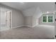 Bright and airy bonus room with carpet and multiple windows at 136 Rainey Rd, Temple, GA 30179