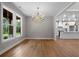 Elegant dining room featuring hardwood floors and a chandelier at 136 Rainey Rd, Temple, GA 30179