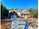 White farmhouse exterior with a welcoming front porch at 136 Rainey Rd, Temple, GA 30179