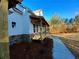 Side view of a farmhouse style home with stone accents and a porch at 136 Rainey Rd, Temple, GA 30179