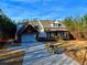 Home exterior with stone accents and a covered front porch at 136 Rainey Rd, Temple, GA 30179