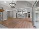 Open and airy Gathering room with high ceilings and a large chandelier at 136 Rainey Rd, Temple, GA 30179