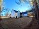 Rear view of house showcasing the exterior and landscaping at 136 Rainey Rd, Temple, GA 30179