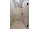 Large walk-in shower with hexagon tile floor and built-in seat at 136 Rainey Rd, Temple, GA 30179