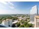 Expansive city view showcasing lush greenery, surrounding buildings, and a clear blue sky at 3324 Peachtree Ne Rd # 2706, Atlanta, GA 30326
