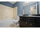 Bathroom with dark vanity and a bathtub and shower at 5620 Orly Ter, College Park, GA 30349