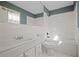 Clean bathroom with white tile, a bathtub, and a vanity at 5620 Orly Ter, College Park, GA 30349