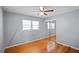 Bedroom with hardwood floors and mirrored closet doors at 5620 Orly Ter, College Park, GA 30349