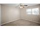 Well-lit bedroom with neutral carpeting and a window at 5620 Orly Ter, College Park, GA 30349