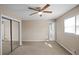 Bright bedroom with mirrored closet doors and neutral carpeting at 5620 Orly Ter, College Park, GA 30349