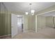 Dining room features neutral walls, carpet, and a chandelier at 5620 Orly Ter, College Park, GA 30349