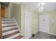 Entryway with staircase, tiled floor, and coat closet at 5620 Orly Ter, College Park, GA 30349