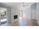 Living room with stone fireplace and sliding glass doors leading to deck at 5620 Orly Ter, College Park, GA 30349