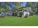 Ranch style home with a well-manicured lawn and mature trees at 4340 W Linda Dr, Douglasville, GA 30134