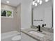 Updated bathroom with granite countertop and black fixtures at 4340 W Linda Dr, Douglasville, GA 30134