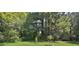 Wooded backyard with a grassy area at 4340 W Linda Dr, Douglasville, GA 30134