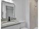 Updated bathroom with granite countertop, black fixtures, and shower at 4340 W Linda Dr, Douglasville, GA 30134