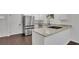 Updated kitchen has stainless steel appliances, white cabinets, and granite countertops at 4340 W Linda Dr, Douglasville, GA 30134