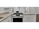Modern kitchen features granite countertops and stainless steel gas range at 4340 W Linda Dr, Douglasville, GA 30134