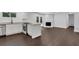 Open concept living space with a fireplace, kitchen, and french doors to the yard at 4340 W Linda Dr, Douglasville, GA 30134