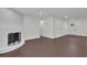 Bright living room features a painted brick fireplace and new flooring at 4340 W Linda Dr, Douglasville, GA 30134